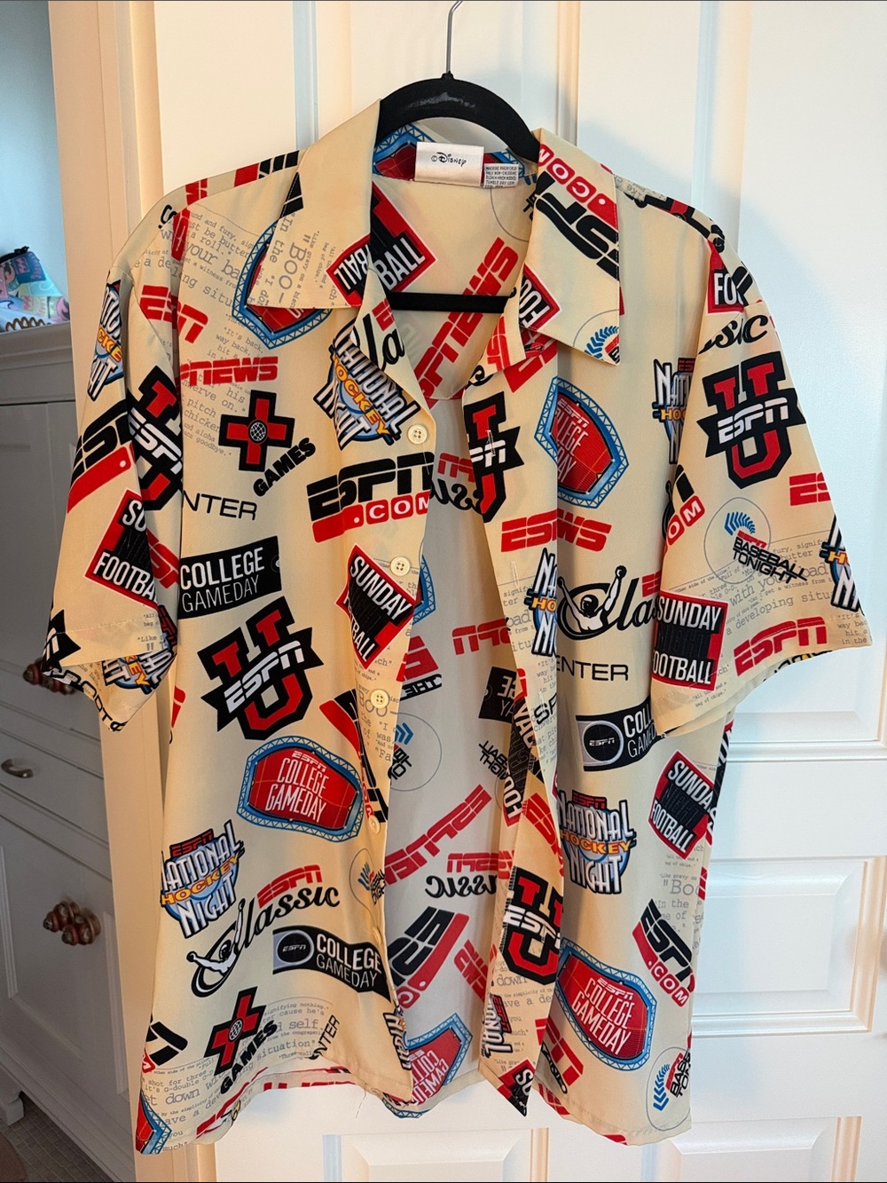 Disney Beige Short-Sleeve Button-Up Shirt with Red, Black & Blue Sports Logos